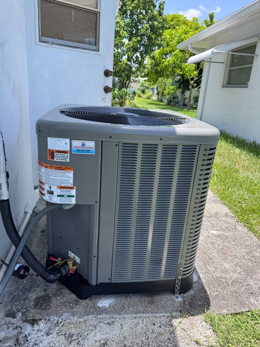 Newly installed AC condenser unit ready for service